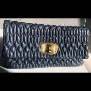 Navy blue clutch with gold hardware
